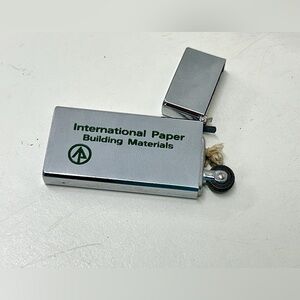 1970s Vintage Barlow INTERNATIONAL PAPER BUILDING MATERIALS Cigarette Lighter